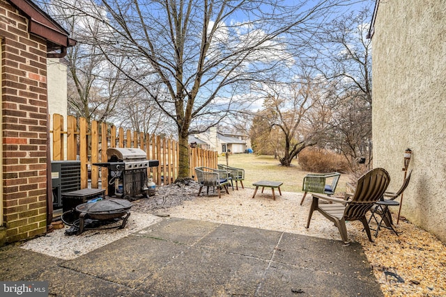 view of patio featuring area for grilling and an outdoor fire pit