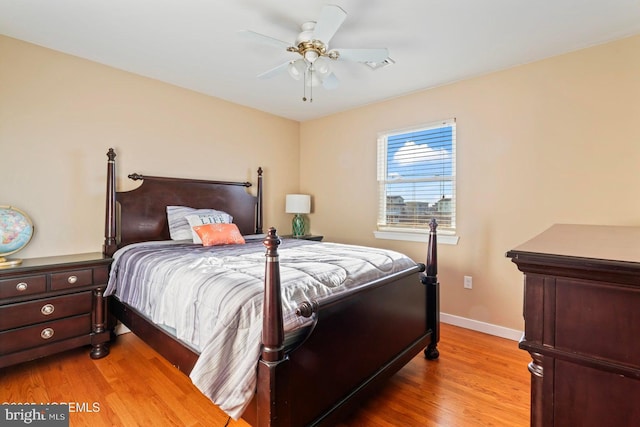 bedroom with light hardwood / wood-style flooring and ceiling fan