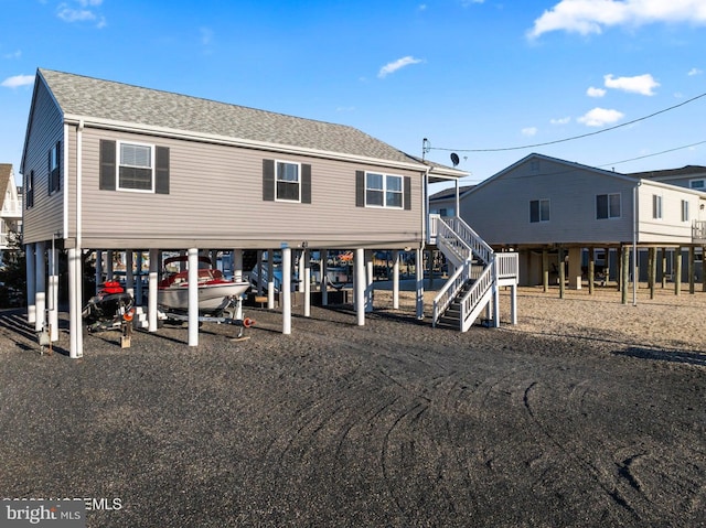 back of property featuring a carport