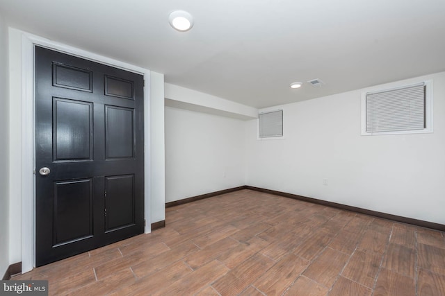 basement featuring wood-type flooring