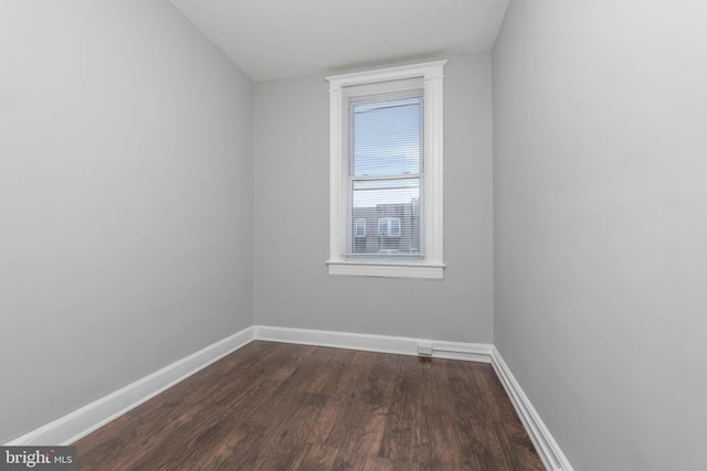 spare room featuring dark hardwood / wood-style floors