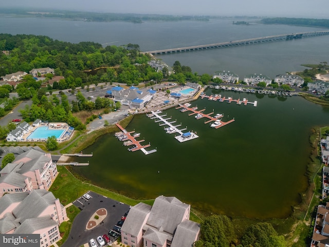 birds eye view of property with a water view