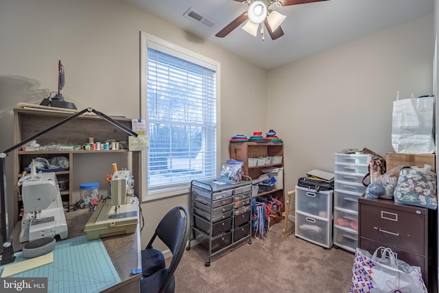 home office featuring carpet flooring and ceiling fan