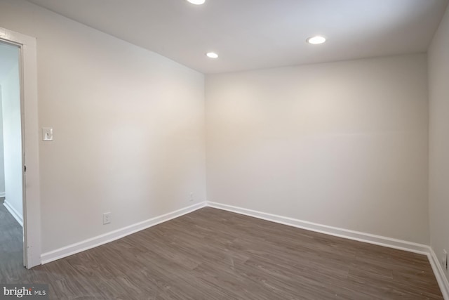 spare room featuring dark hardwood / wood-style floors