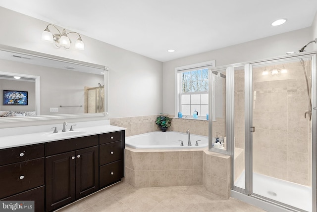 bathroom with tile patterned floors, plus walk in shower, and vanity