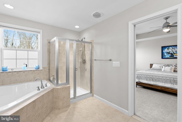 bathroom featuring ceiling fan and plus walk in shower