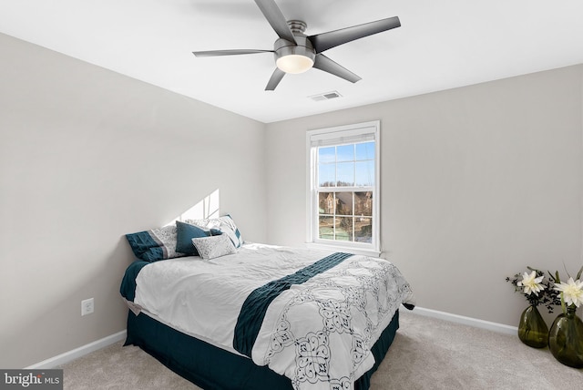 bedroom featuring ceiling fan and light colored carpet