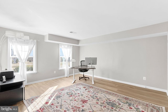 home office with light wood-type flooring