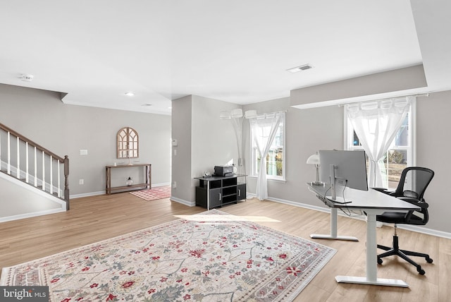 office space with light hardwood / wood-style floors