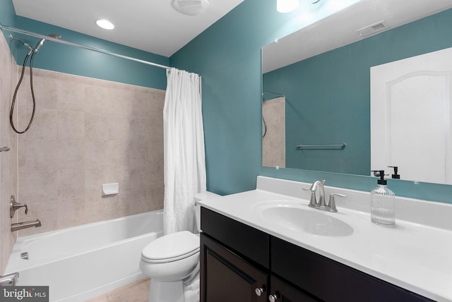 full bathroom featuring shower / tub combo with curtain, vanity, toilet, and tile patterned floors