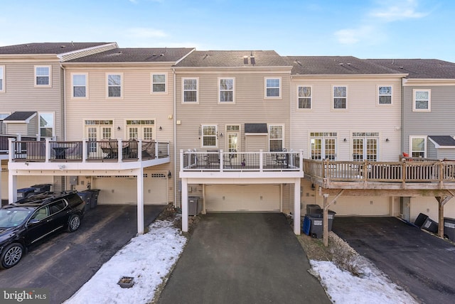 snow covered property with a balcony