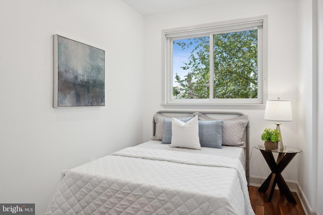 bedroom featuring dark wood-type flooring