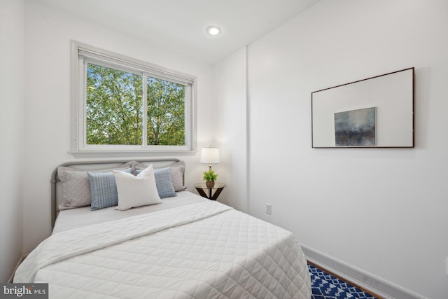 bedroom with hardwood / wood-style floors