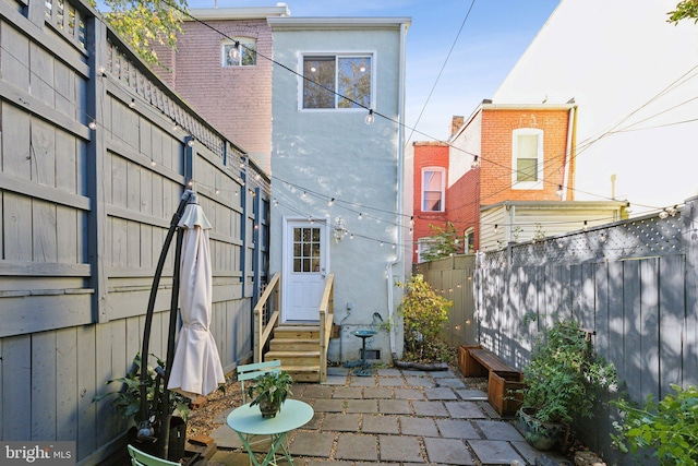 rear view of house with a patio