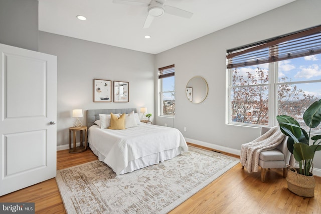 bedroom featuring ceiling fan and wood-type flooring