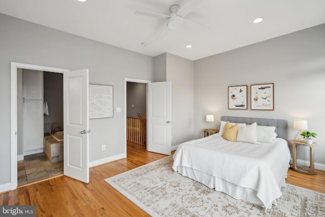 bedroom with light wood-type flooring and ceiling fan