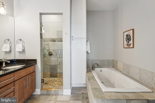 bathroom featuring vanity and separate shower and tub