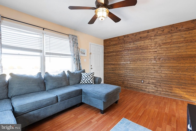 living room with ceiling fan and hardwood / wood-style floors