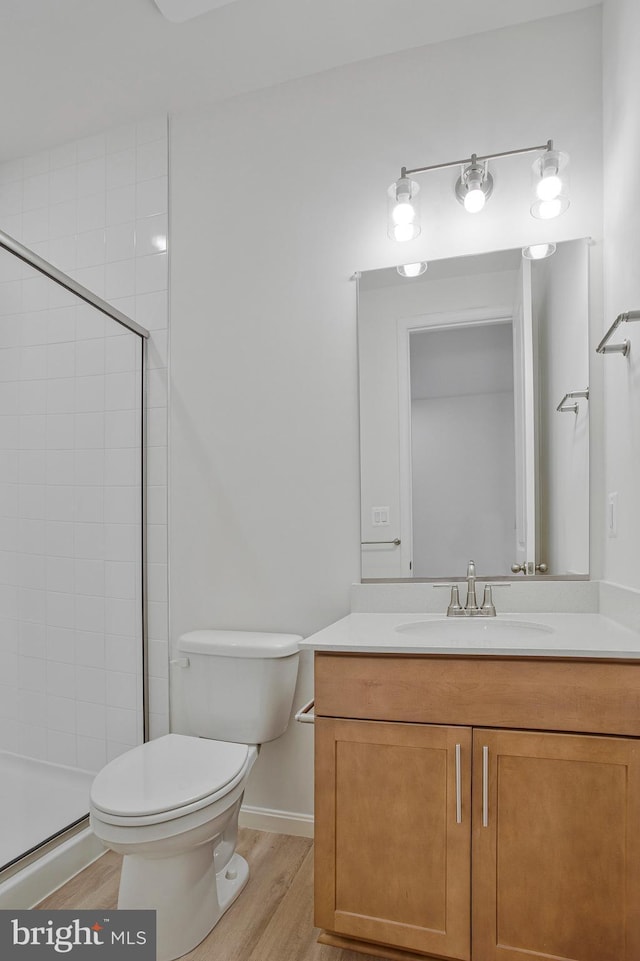 18 Aspen Dr, North East, MD 21901 - bathroom featuring toilet, vanity, a tile shower, and wood finished floors