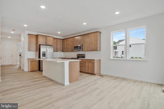 18 Aspen Dr, North East, MD 21901 - kitchen featuring stainless steel appliances, light wood-type flooring, light countertops, brown cabinetry, and recessed lighting