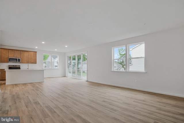 18 Aspen Dr, North East, MD 21901 - unfurnished living room with light wood-style flooring, recessed lighting, and baseboards