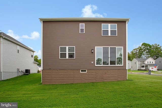18 Aspen Dr, North East, MD 21901 - rear view of property with a lawn and central air condition unit