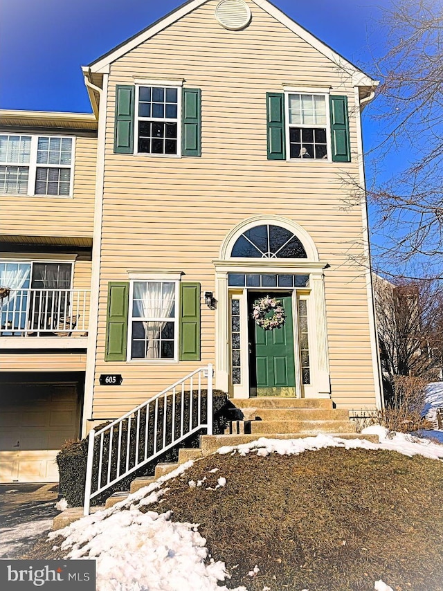 view of front of property with a garage