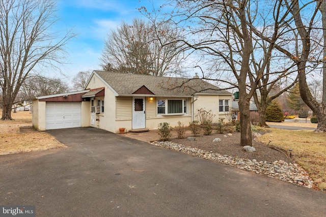 ranch-style home featuring a garage