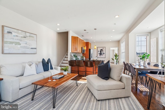 living room with light hardwood / wood-style flooring