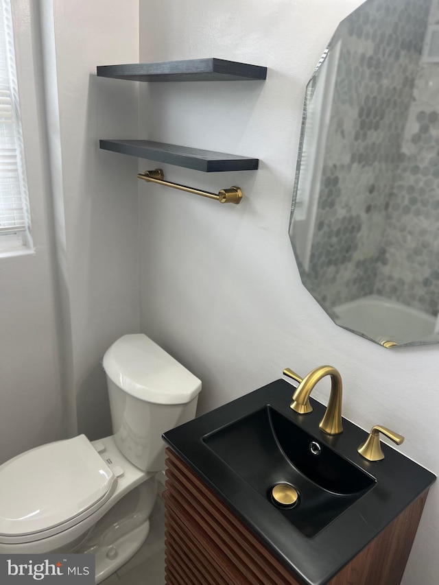 bathroom with vanity and toilet