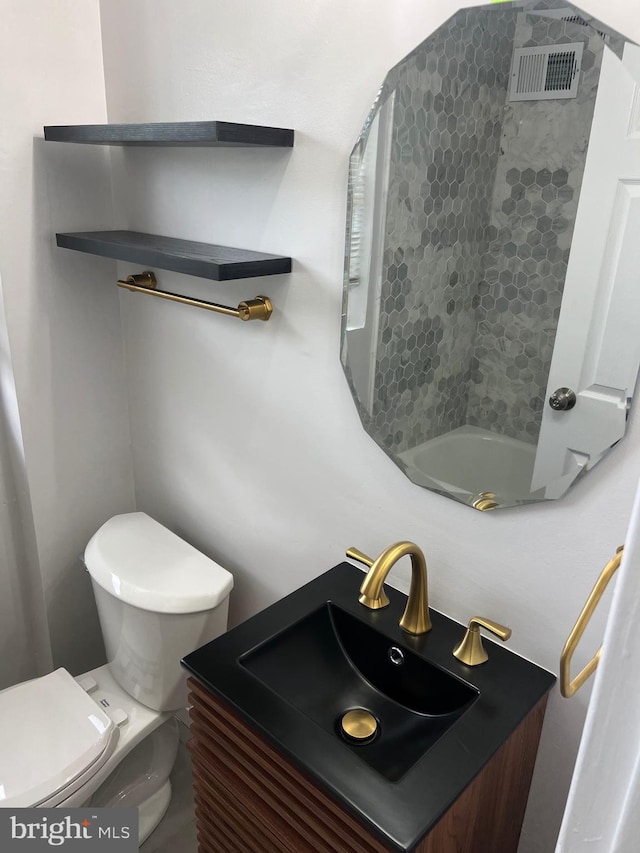 bathroom with vanity and toilet