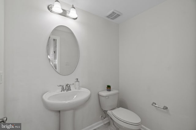 bathroom featuring toilet