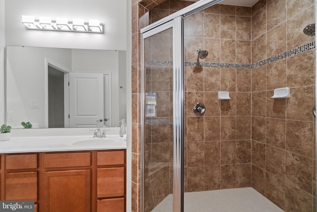 bathroom with vanity and an enclosed shower