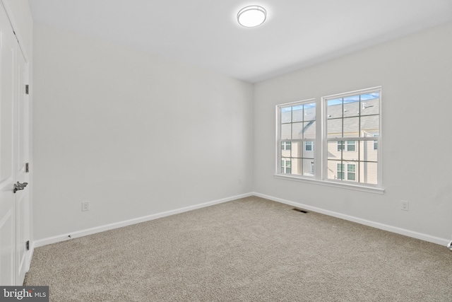 unfurnished room featuring carpet flooring