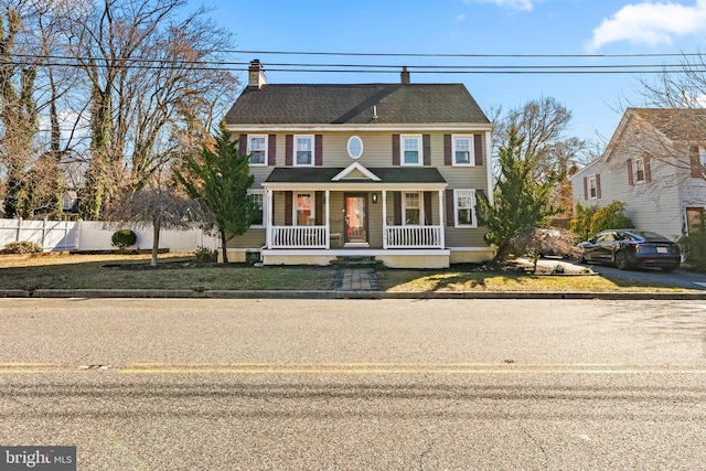 colonial home featuring a porch