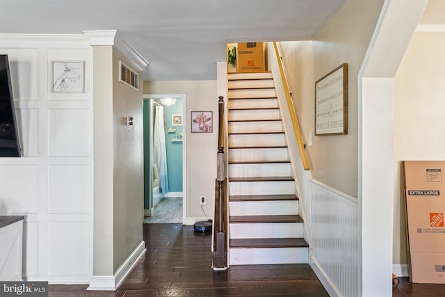 stairway with hardwood / wood-style flooring