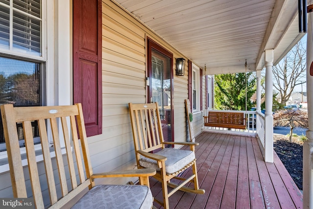 wooden deck featuring a porch