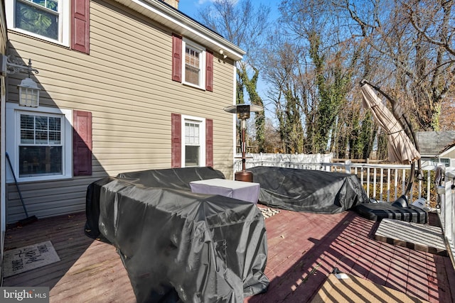 wooden terrace featuring area for grilling