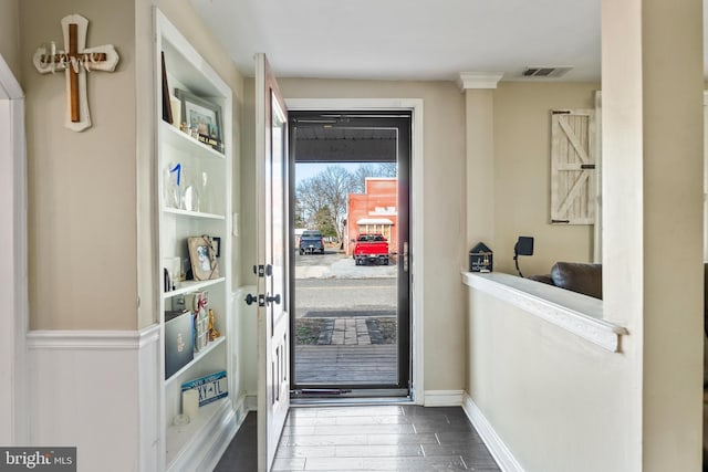 doorway to outside featuring wood-type flooring