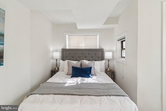 bedroom featuring multiple windows