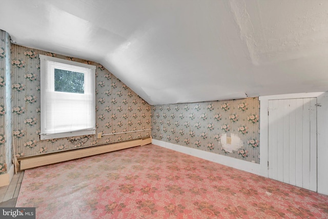 bonus room featuring lofted ceiling, a baseboard heating unit, and carpet