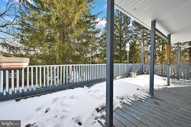 view of snow covered deck