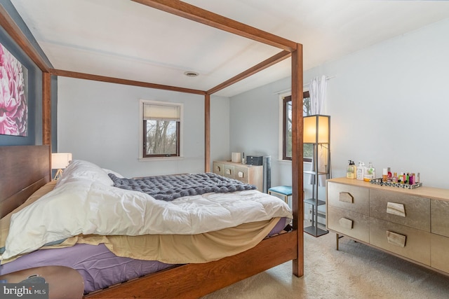 bedroom featuring light carpet