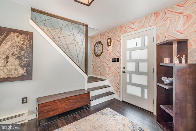 foyer featuring plenty of natural light, dark hardwood / wood-style floors, and baseboard heating