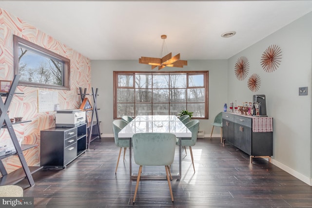 dining space with dark hardwood / wood-style flooring