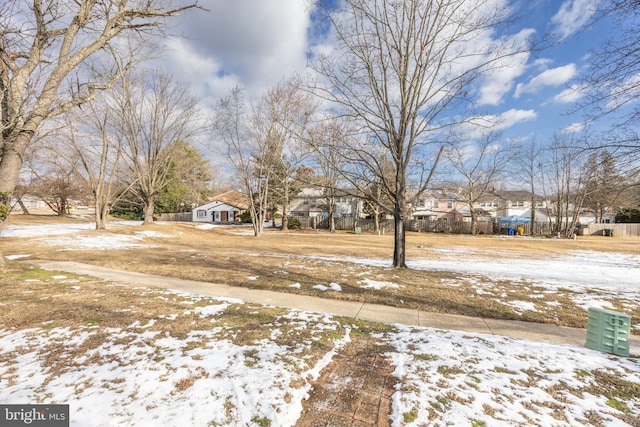 view of yard layered in snow