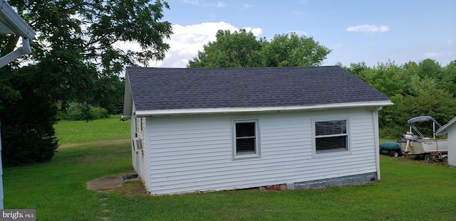 view of outbuilding with a lawn