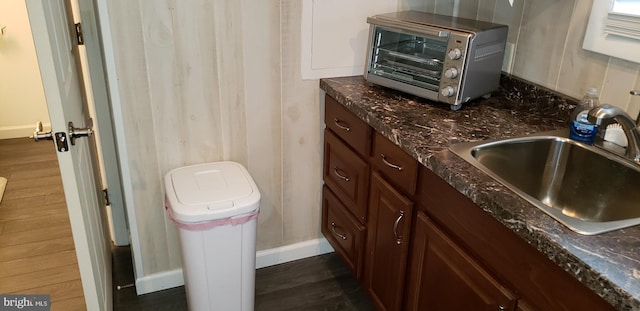 bathroom with sink and wood-type flooring