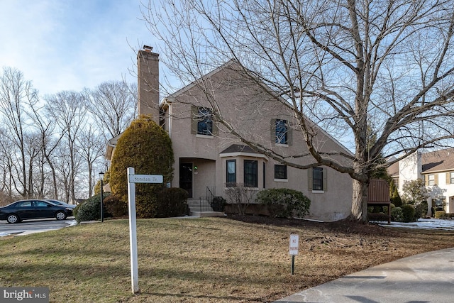 view of property featuring a front yard