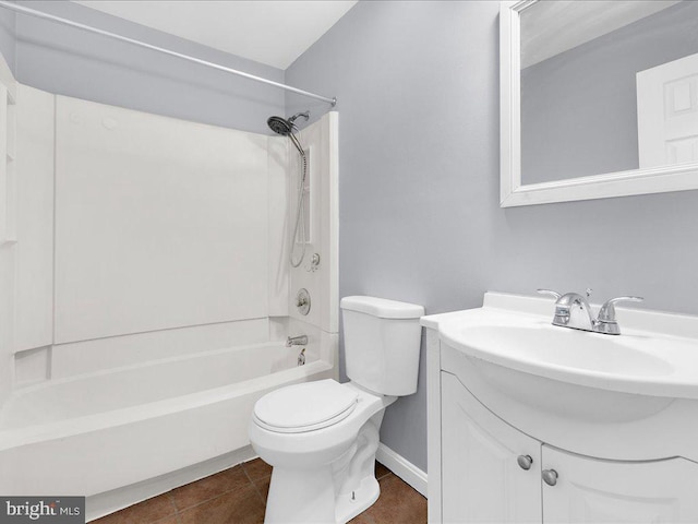 full bathroom with shower / bathing tub combination, vanity, tile patterned floors, and toilet